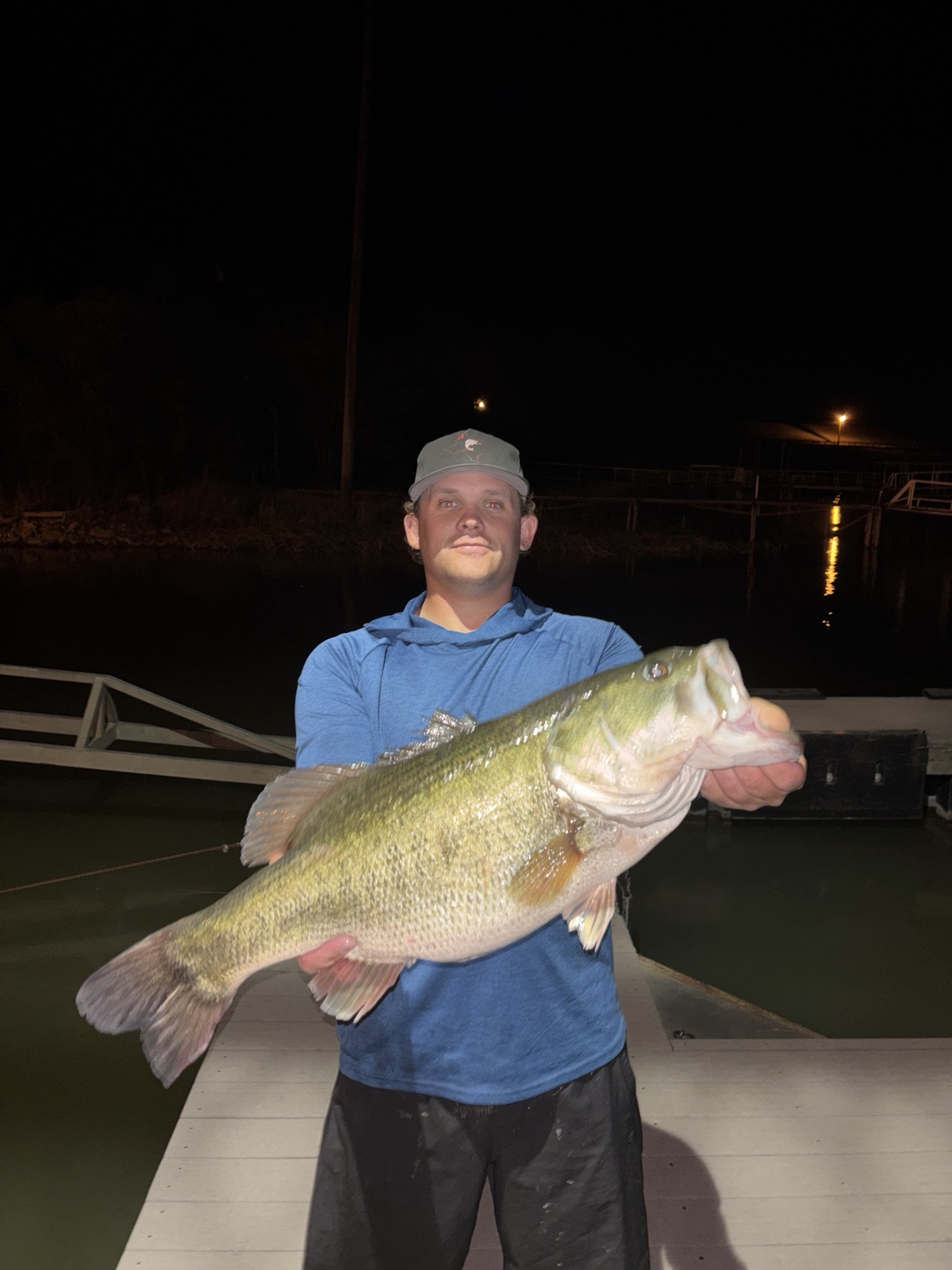 Fishing guide holding a largemouth bass